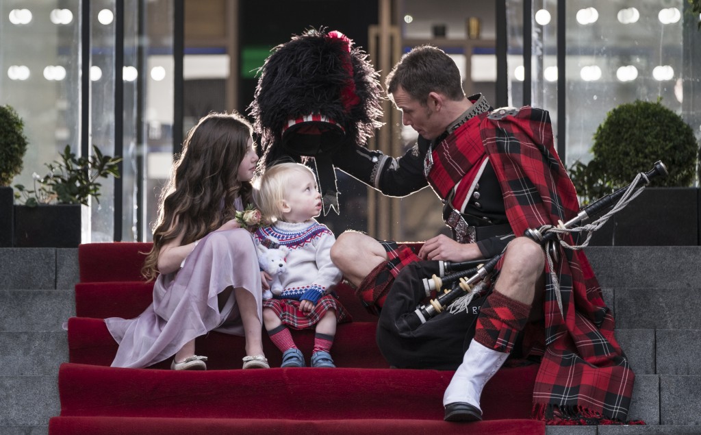 Roddy the piper with flower girl and page boy at G&V Edinburgh